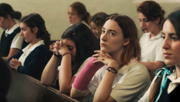 GIRL PRAYING IN PEW