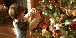 LITTLE,BOY,DECORATES,CHRISTMAS,TREE