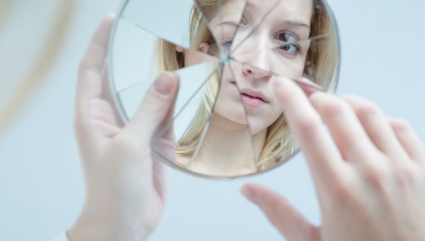 Woman looking in the mirror