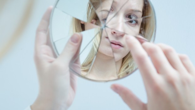 Woman looking in the mirror