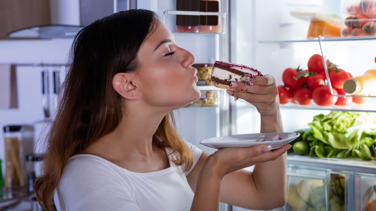 WOMAN EATING SWEET