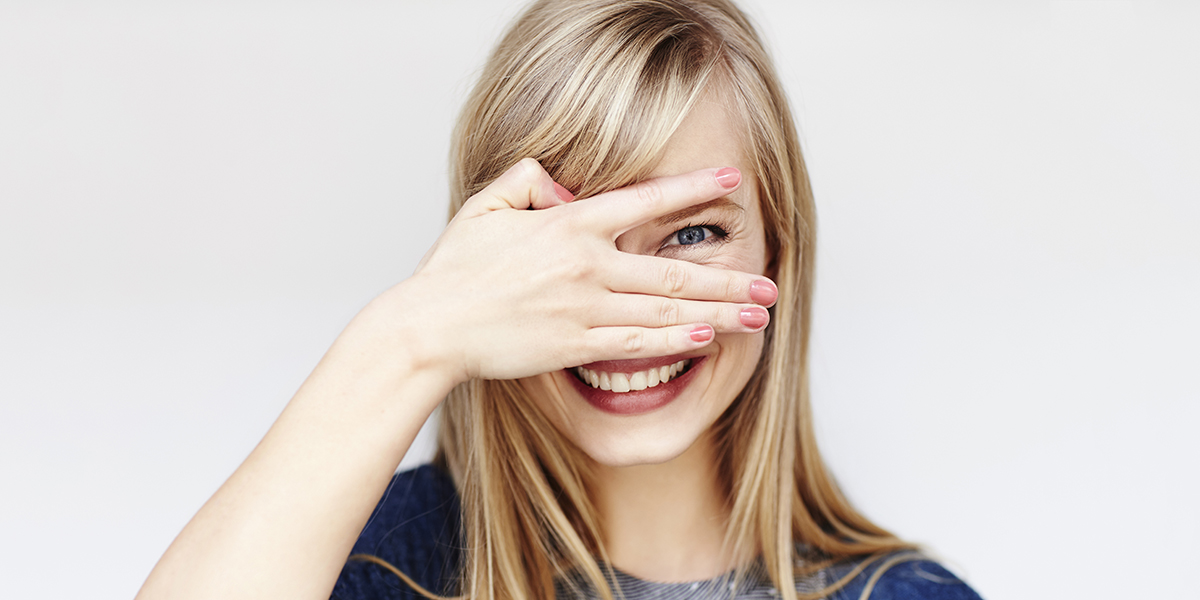YOUNG BLOND WOMAN SMILING