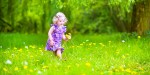 LITTLE GIRL PLAYING GARDEN