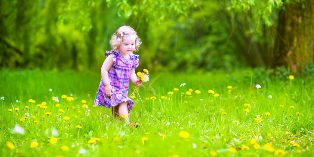 web3-a-little-girl-playing-in-a-spring-garden0a-shutterstock_189573599