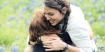 SISTERS HUGGING