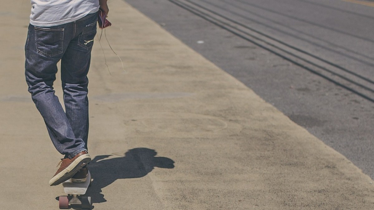 TEEN BOY ON SKATEBOARD
