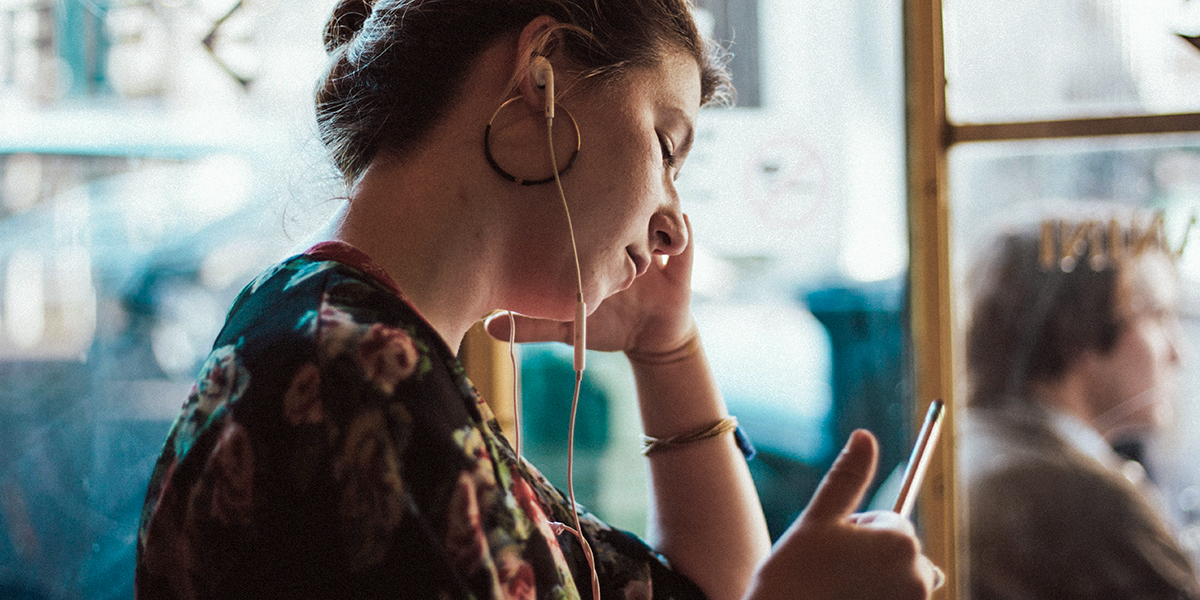 WOMAN LISTENING TO MUSIC