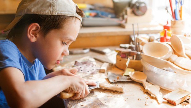 BOY CARVING