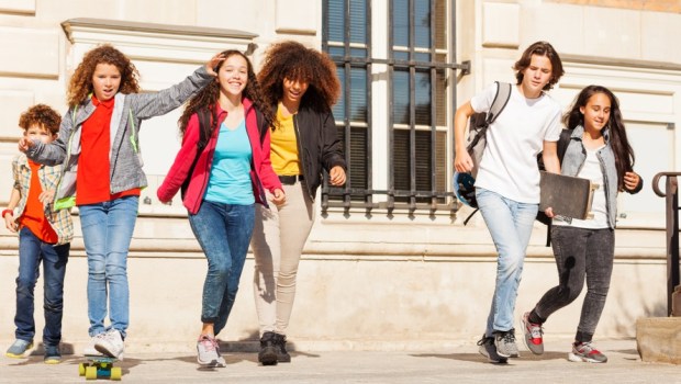 Happy teens having fun at school