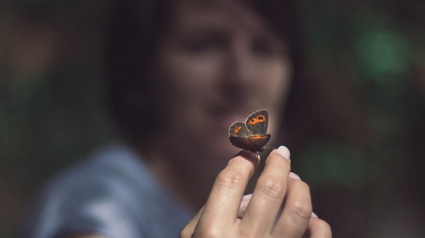 WOMAN WITH BUTTERFLY