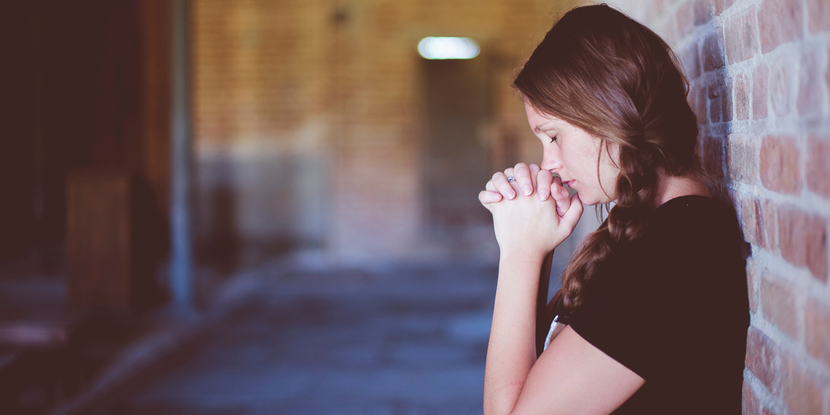 YOUNG,WOMAN,PRAYING