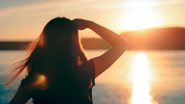 woman looking at the sunset