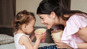 mother drinking tea with her daughter