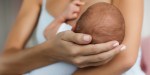 mother breastfeeding newborn baby