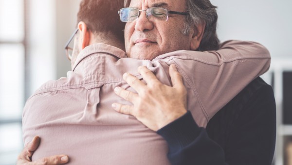 son hugs father