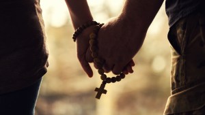 Couple Praying Rosary
