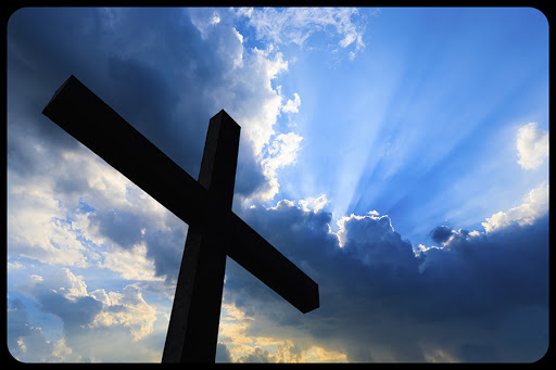 Cross silhouette and the holy blue sky © f11photo / Shutterstock