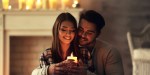 COUPLE AT HOME HOLDING CANDLE