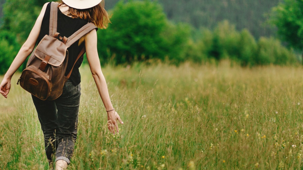 web3-girl-walking-grass.jpg