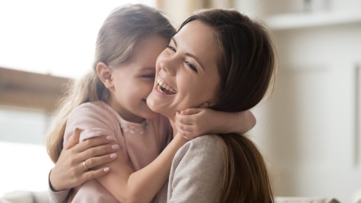 MOTHER DAUGHTER LAUGHING