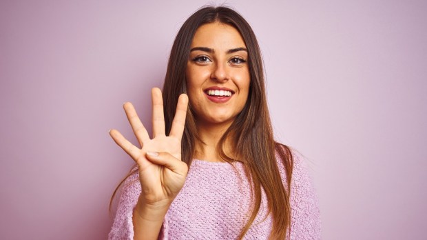 WEB3-WOMAN-YOUNG-SMILE-HAND-FOUR-SHUTTERSTOCK.jpg