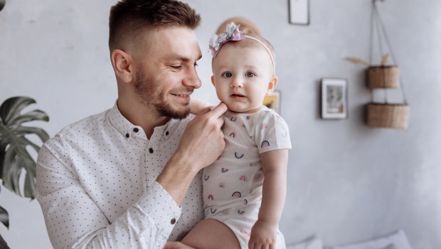 DAD HOLDING CHILD