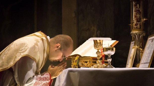 PRIEST PRAYING