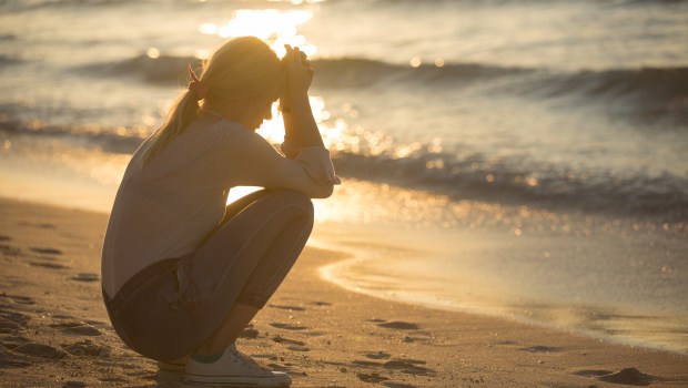 SAD WOMAN, BEACH