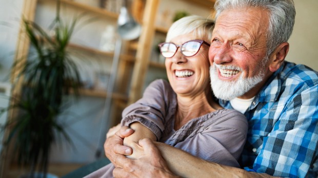 happy elderly couple man woman laughing