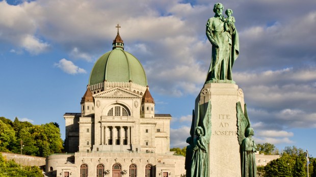 St.Joseph Oratory and St.Joseph monument, at sunset, with cloudy sky