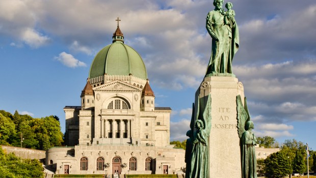 St.Joseph Oratory and St.Joseph monument, at sunset, with cloudy sky