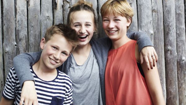 Three siblings laughing