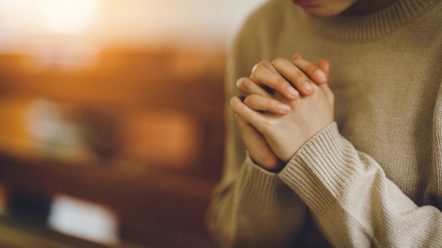 Holding hands in prayer