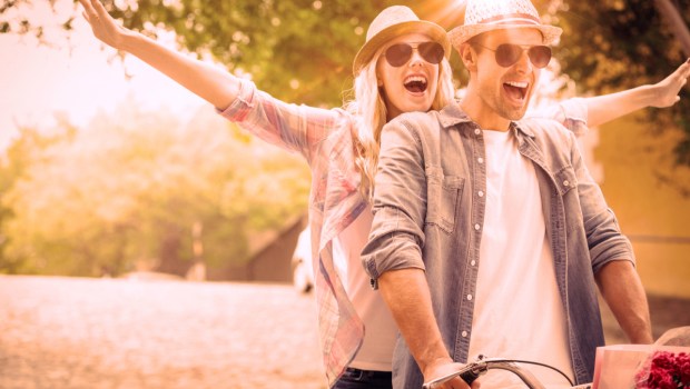 Happy couple on a bike