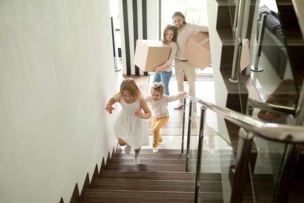 parenting with kids running upstairs during move