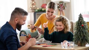 family-making-Christmas-cards_Ground-Picture_Shutterstock_1832512438.jpg