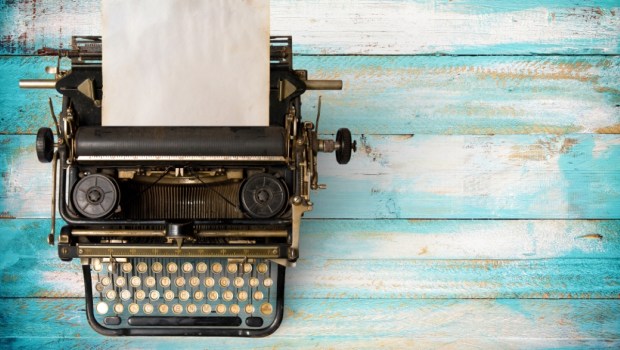 Vintage typewriter header with old paper