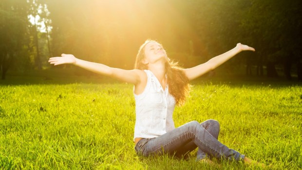 young woman with outstretched arms