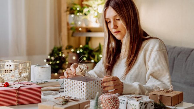 woman wraping gifts