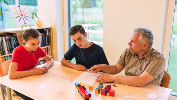 Teenagers with the teacher at school