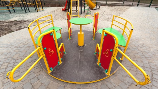 Carousel for disabled children in an inclusive playground