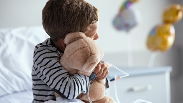 sick child in hospital bed