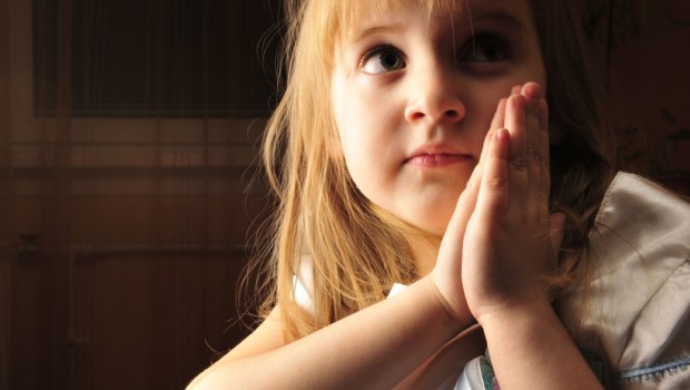 young praying girl