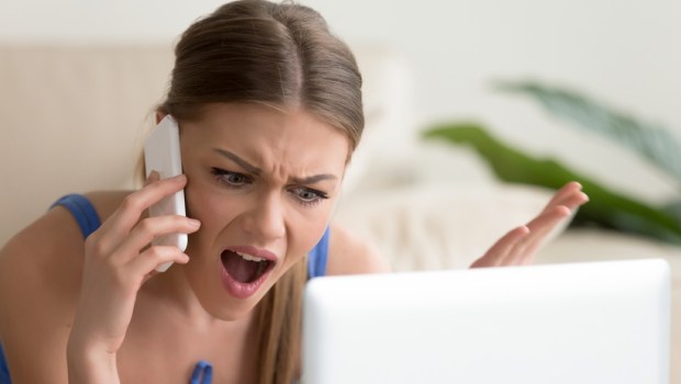 Angry dissatisfied young woman