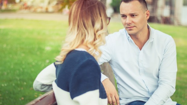 Couple talking outdoors in a park