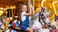 girl smiling carousel