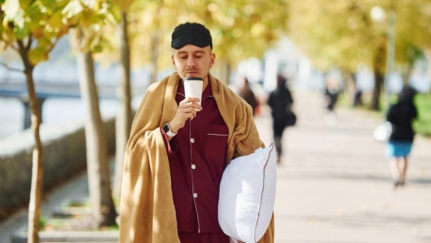 man in pajamas on the street