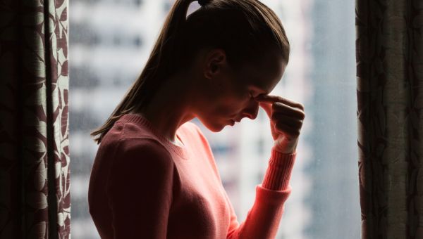 Worried woman in shadow