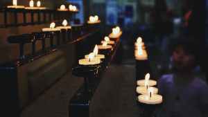 white tealight candles lit during nighttime