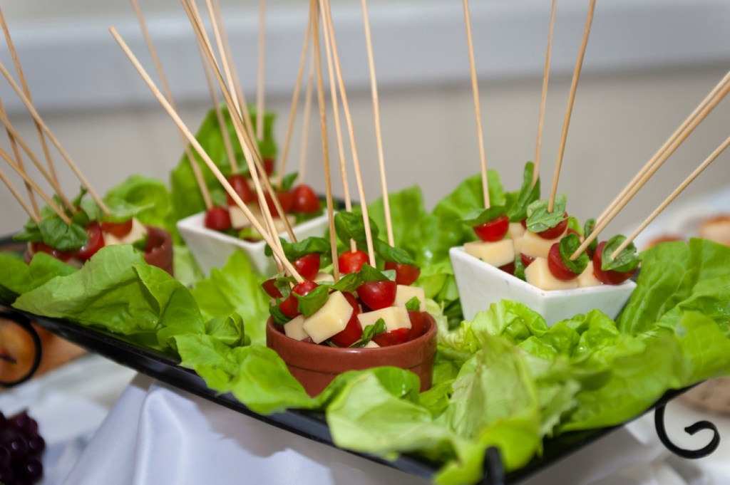 tomato cheese basil skewer, capresse in bowls and spoons for decoration on event table